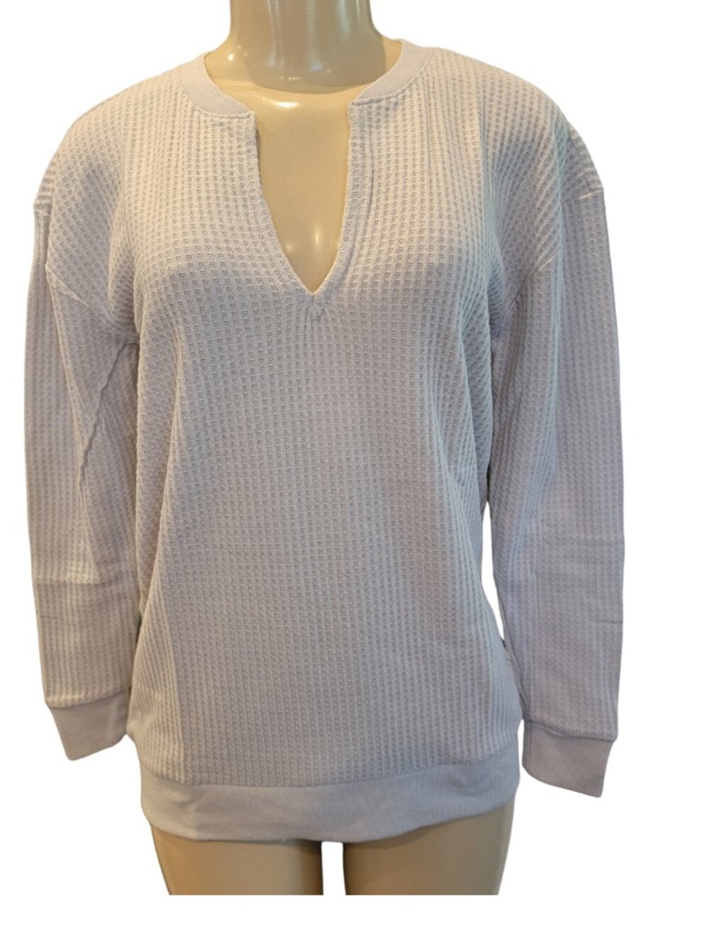 Loft V-neck sweater features a textured waffle-knit material in a light gray